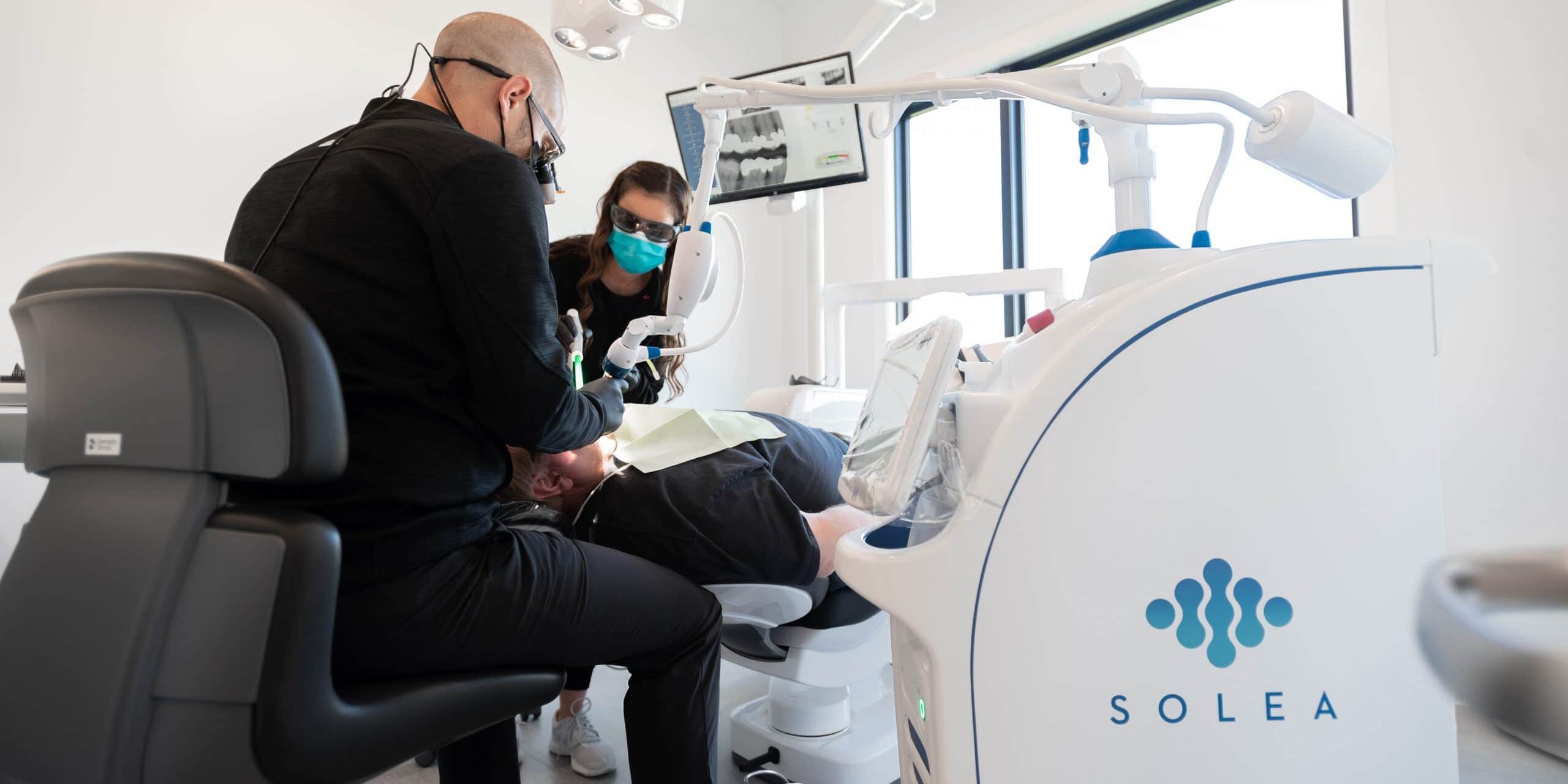 dr. anderson using the solea laser. missouri river dental <br>features the latest in dental technologies. 